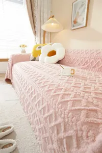 Close-up of pink thickened plush sofa cover featuring 3D geometric jacquard texture