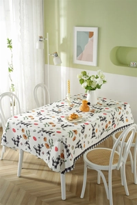 Polyester tablecloth detail showing Easter bunny and egg patterns on white plaid