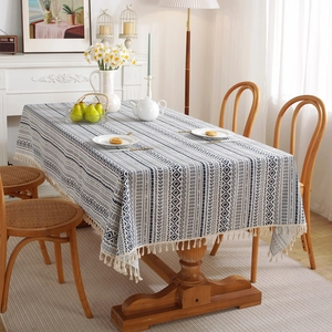 Rectangular bohemian tablecloth with blue geometric patterns and white tassels