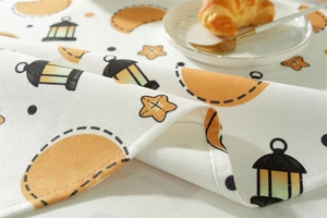 Close-up of waterproof polyester tablecloth featuring Ramadan stars, moons, and lantern motifs