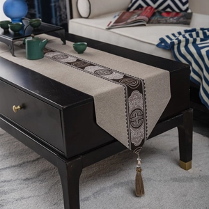 Classic Chinese table runner with traditional geometric patterns and elegant tassels