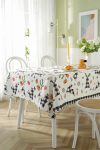 Detailed pattern of Easter rabbits with floral and vintage egg prints on table cloth