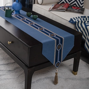 Classic Chinese style blue table runner with geometric patterns and tassel detail