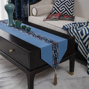 Elegant blue New Chinese style table runner with embroidered floral patterns and tassels