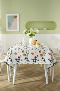 Detail of waterproof Easter tablecloth featuring checkered rabbits and spring daisies