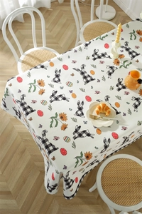 Detail of waterproof Easter tablecloth featuring plaid bunnies and colorful eggs patterns