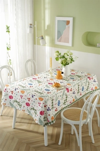 Close-up of Easter polyester tablecloth featuring plaid rabbits and floral patterns