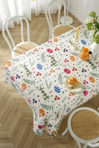 Easter floral tablecloth with green plaid bunny and eggs on a white background