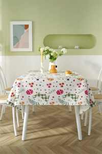 Detailed view of polyester Easter tablecloth with bunny prints and spring floral pattern
