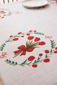 Detailed macro view of the tulip print and linen texture on the festive tablecloth