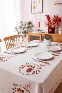 Detail of red tulip and bow print on durable linen tablecloth for wedding decor