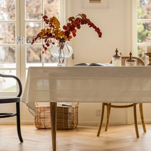 Beige polyester jacquard tablecloth with elegant braided stripes and geometric hollow patterns