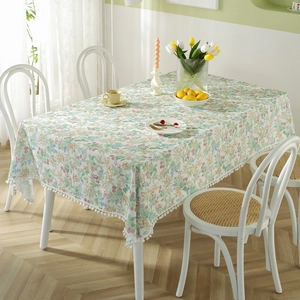 French cotton tablecloth with floral berry prints and white pom-pom fringe decoration