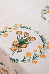 Detailed texture of polyester-linen tablecloth featuring vintage yellow tulip prints