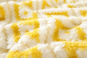 Macro detail of thick yellow and white wave pattern plush sofa cover fabric texture