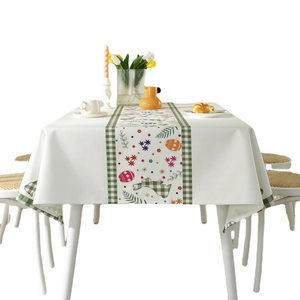 Easter tablecloth with rabbit and egg floral print on a white festive dining table setup