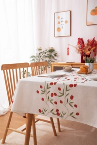 Macro detail of red tulip print on beige cotton linen fabric for rectangle tablecloth
