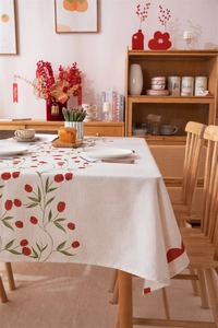 Detail of red tulip floral digital printing on beige cotton linen wedding tablecloth