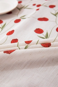 Close-up of linen fabric texture with vintage red tulip and green leaf floral prints