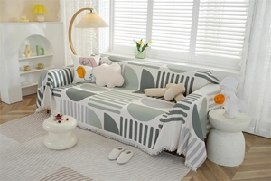 Detail shot of waffle weave fabric with geometric patterns and delicate fringe edges