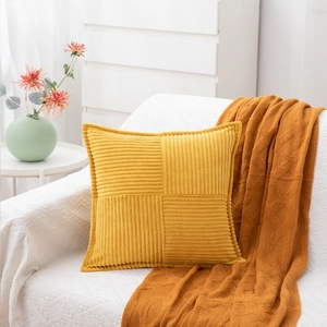 Modern yellow corduroy striped square pillow cover on white sofa with home decor