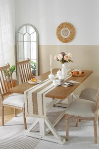 Detailed close-up of woven cotton linen table runner with vertical stripes and boho tassels