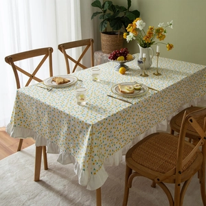 Floral cotton tablecloth with yellow daisy prints and elegant ruffled edges for home dining