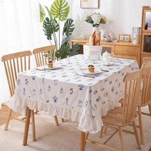 Floral cotton tablecloth with blue botanical embroidery and ruffled edges for home dining