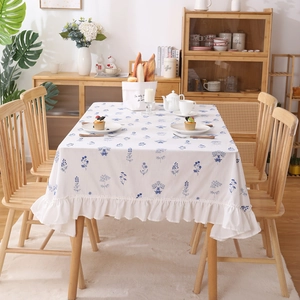 White cotton tablecloth with blue floral embroidery and pleated ruffle hem for dining tables