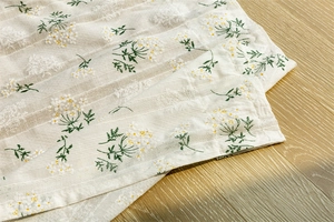 Detail of floral embroidery and hollow stripe on cotton partition door curtain