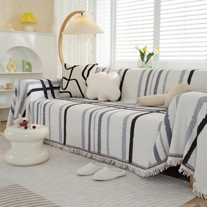 Nordic waffle texture sofa cover with geometric stripes and decorative tassels