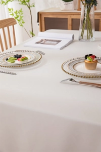 Detail of waterproof cream PVC tablecloth with a textured finish and macaron minimalist style