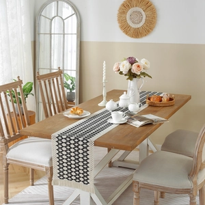 Cotton linen woven table runner with black and white diamond pattern and tassels