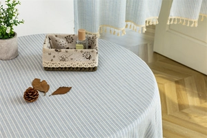 Detailed texture of blue striped cotton linen fabric with natural soft drape and weave