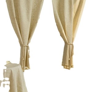Beige linen door curtain with tassels and matching tablecloth in Japanese rustic style