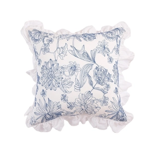 French country style white cotton pillow with blue floral print and ruffle edges