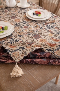 Detailed view of vintage floral jacquard tablecloth with premium fringe edge and thick texture