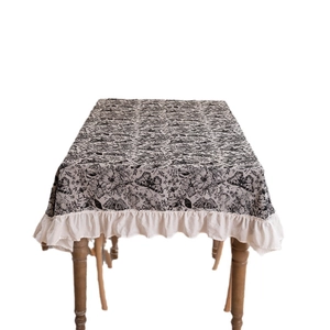 Vintage jacquard butterfly tablecloth with ruffled edges and fringe on white background