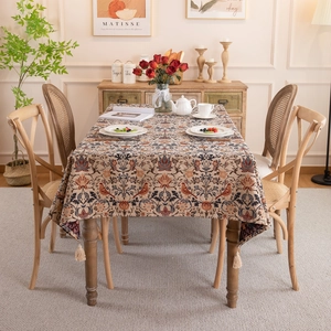 Retro jacquard tablecloth with magpie flower pattern and tassels on a dining table