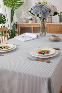 Detail shot of the cotton jacquard striped tablecloth fabric with fine fringe edge finish
