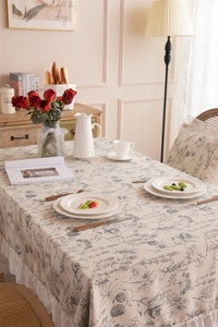 Close-up of French floral polyester tablecloth featuring elegant ruffles and vintage patterns