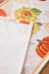Detail of harvest pumpkin print on polyester-cotton table runner with durable stitching