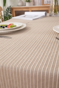 Close-up of geometric striped jacquard cotton tablecloth with textured woven details