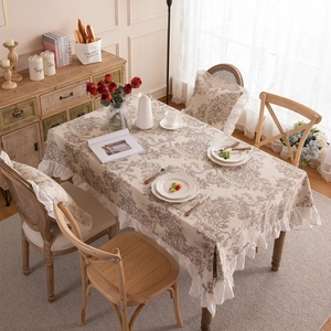 French country style floral tablecloth with ruffled edges and tree shadow print on warm beige