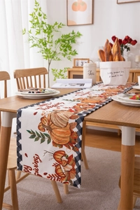 Detail of Thanksgiving table runner with pumpkin prints and Happy Thanksgiving text