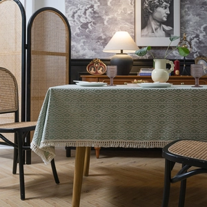Mantel retro turquesa con diseño geométrico de diamantes y borlas elegantes para hogar