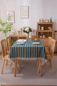 Detail showing Bohemian gold striped pattern and fringe on poly-cotton tablecloth