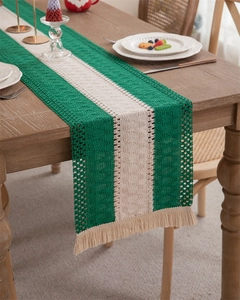 Close-up of hand-woven cotton linen table runner with green stripes and fringe details