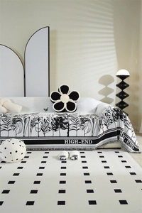 Detail of high-end chenille sofa cover with tropical leaves and tassel fringe trim