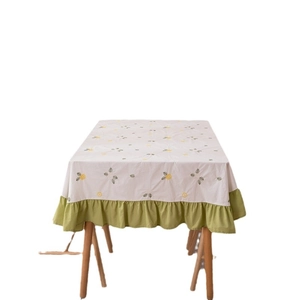 Floral cotton tablecloth with green ruffle hem and delicate embroidery for dining table